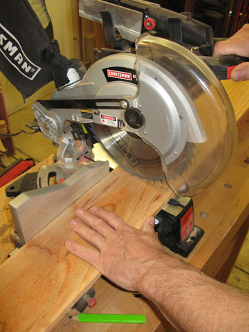 Figure 1: Cutting the side boards to length. They are made from cedar fence boards.