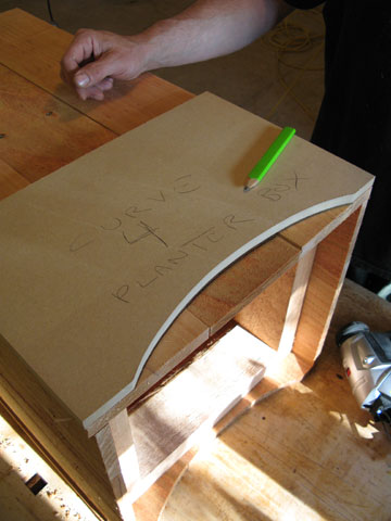 Figure 3: Lay out the curve on a piece of scrap lumber and transfer it to each side for consistency.