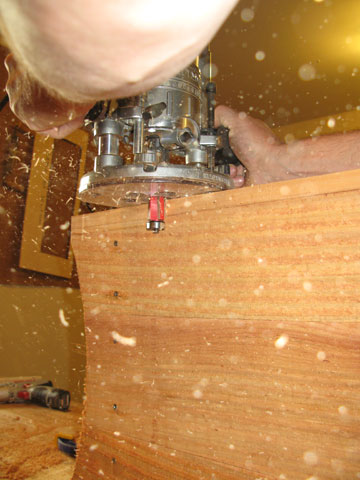Figure 5: Use a pattern-routing bit in a handheld router to trim the corners flush.