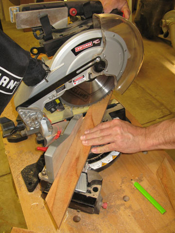 Figure 6: A power miter saw cuts the trim that finishes the top of the planter.