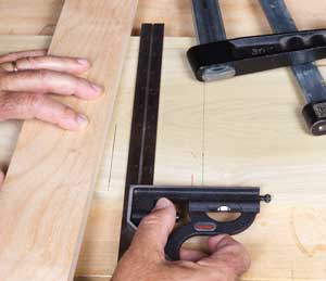 Use a square to ensure your fence is properly aligned as you position and clamp it.