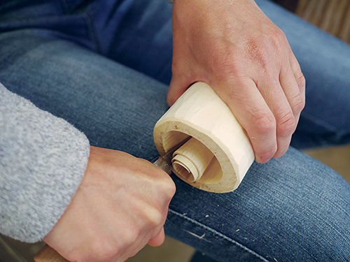 When hollowing out the branch, if you tire of rolling the wood clockwise away from you with the knife pointing away, switch it around with the blade toward you (palm up) and roll the wood towards you, counterclockwise.