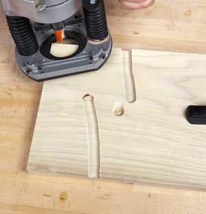 Cutting freehand with a straight bit will demonstrate to you where to locate a guide fence to achieve a straight cut. The router will always tend to veer counterclockwise.