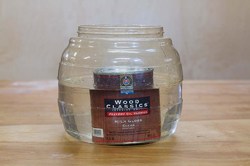 For smoother spraying, heat the can of finish by immersing it almost to the lid in a bucket of hot water.