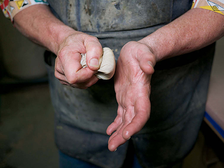 Then tamp the pad against your palm to disperse the finish throughout.