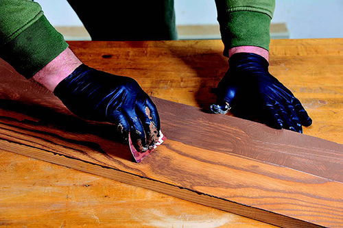Then squeegee it off immediately with a credit card held at right angles to the grain, but dragged in the direction of the grain.