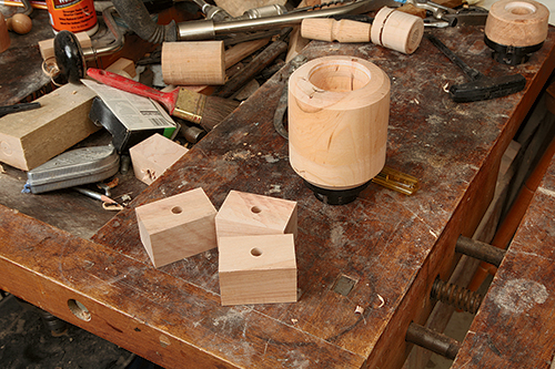 It’s best to drill the 7/16”-dia. cross-hole that facilitates mounting the cups on the handle before turning the cups to final shape.