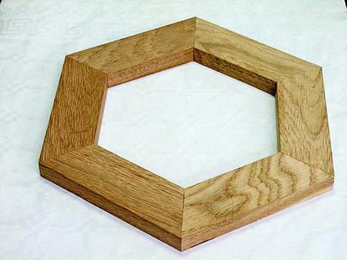 Six- and eight-sided figures can also be mitered precisely with this jig by including stops for 22.5° and 30°, which adds to its usefulness.