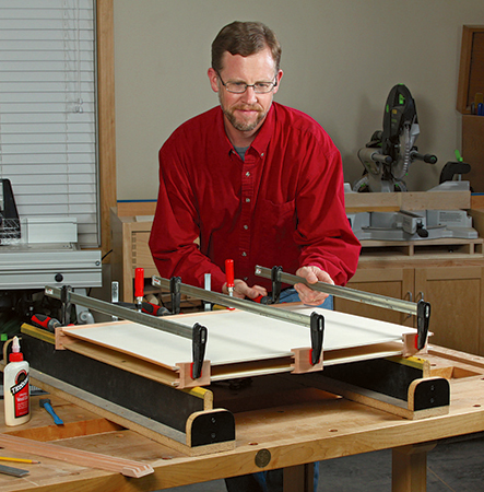 Glue and clamp the top and bottom panels to each side piece to create the main housing.
