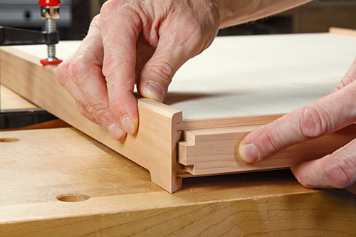 Dry-fit the sides, top and bottom panels to check the final size of the center support. It should seat easily in the tray grooves and fit flush between the inside panel faces.
