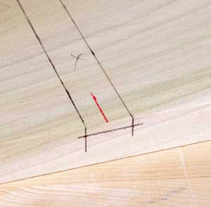 Here's the dado I want to cut all laid out. But elaborate marking isn't necessary for routing it. The red center line (or a similar mark delineating one of the shoulders) is the only layout you need.