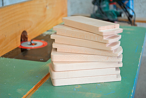 After the rabbets and clearance angles are cut on the bases, set a piloted chamfering bit in the router table for a slight cut, and ease all of the sharp edges. Or, break these edges with sandpaper instead. It’ll make the parts less prone to edge splinters and give them a finished look.