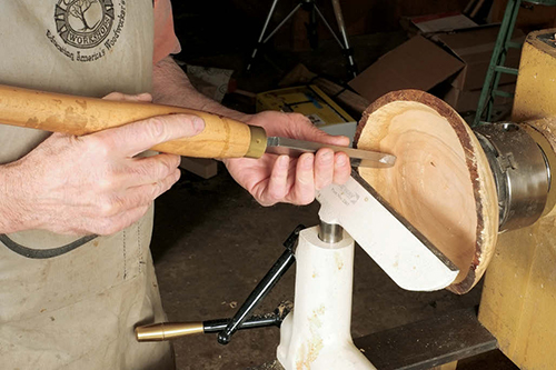 A large dome scraper is excellent for all faceplate work, but especially bowls. The author uses the large size shown here the most, but also finds its smaller brother to be useful. It is often more effective to tilt the scraper on the sidewall of a bowl, as seen in this photo.