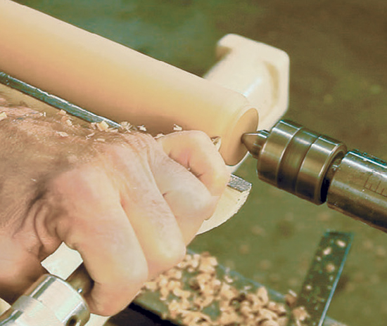 Chuck the billet on center to turn the pad foot and half bead. Then bring the rest of the leg shaft round to the pommel.