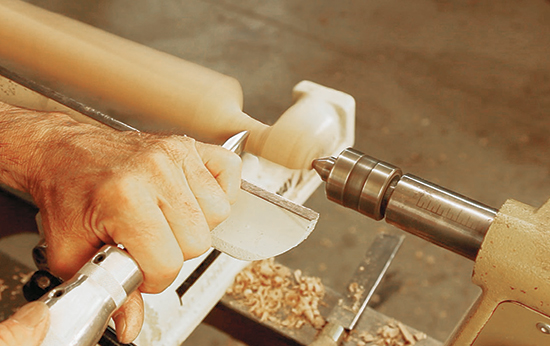 Chuck the billet on center to turn the pad foot and half bead. Then bring the rest of the leg shaft round to the pommel.