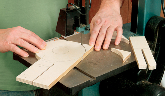 Next, using a band saw (or jigsaw), cut a 6”-diameter circle on the area of the baseplate opposite the tongue cut on the table saw in the last step.
