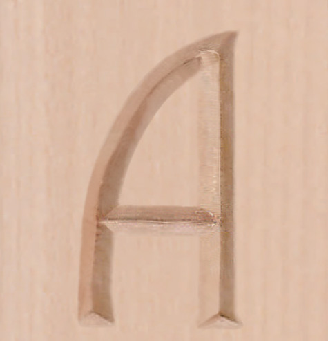 Figure 3: Remove the paper and sand the surface smooth. If you're painting the carved area, leave the paper on.