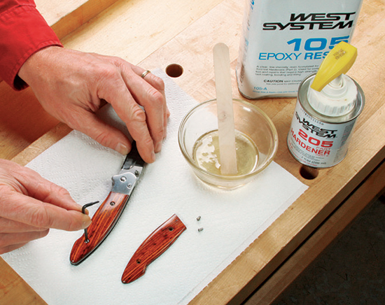 Continue to shape and smooth the handle. Hold the knife against a clamped belt sander near the front wheel so the belt spins away from you.