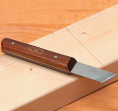 prefer a flat-backed, double bevel-edged marking or “striking knife 