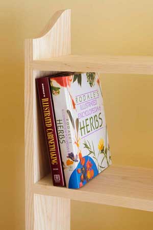 Even without a back, bookshelves constructed with tight sliding dovetails are free of wobbling or leaning out of square.