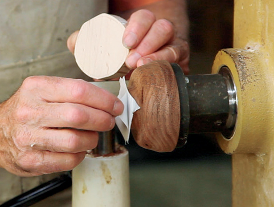 Photo 1: Flatten the face of a scrap wood chuck, and apply a piece of double-sided tape to it.