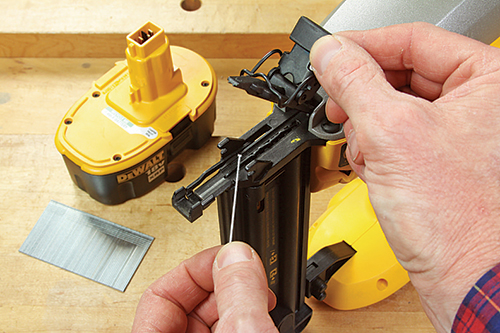 Flipping a lever releases the nose cover on this DeWALT and several other nailers for clearing jams.