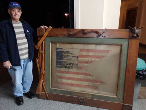 Previous Veterans Council Commander Bob Page with flag the week it was found. (photo courtesy of Richard P. Howe, Jr.)