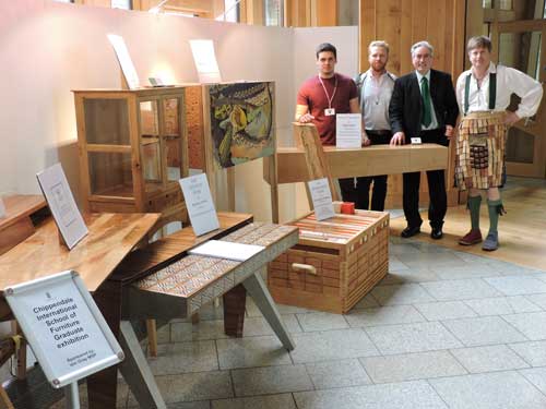 Pictured at Scottish Parliament, left to right: Hugo Gray and Isaac Thompson, furniture students; Iain Gray MSP (member of Parliament); Anselm Fraser (Chippendale School founder)