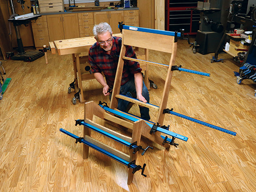 Dry fitting Adirondack chair frame with several bar clamps
