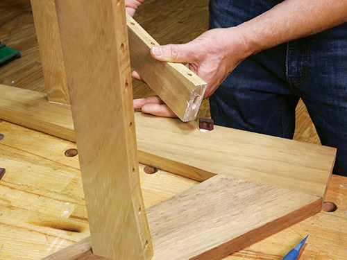 Close-up of gluing up Dominoes in Adirondack frame