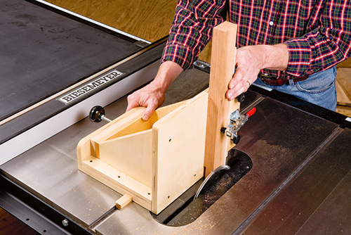 Adjustable tenoning jig in use on a table saw