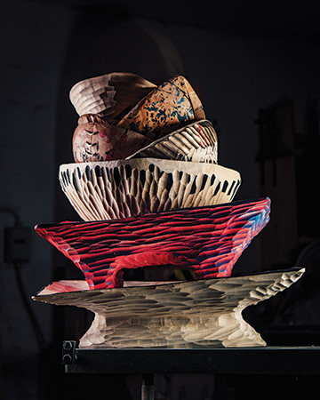 Collection of wooden bowls in a sculpture