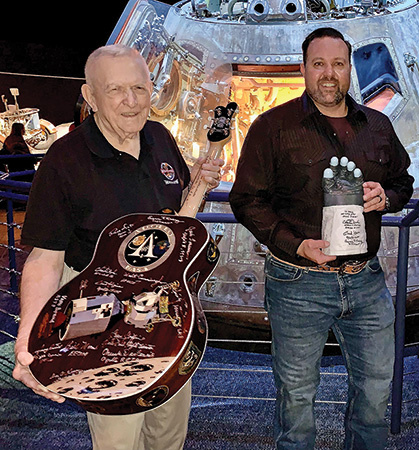 Eugene Kranz posing with Apollo guitar