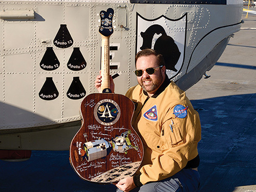 Displaying Apollo program themed guitar