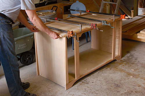 Solid oak banding on entertainment center case