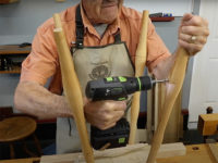 Drilling stretcher holes for a stool