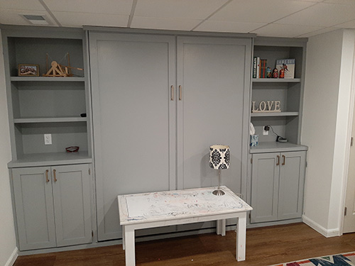 Basement wall bookcase with cabinet