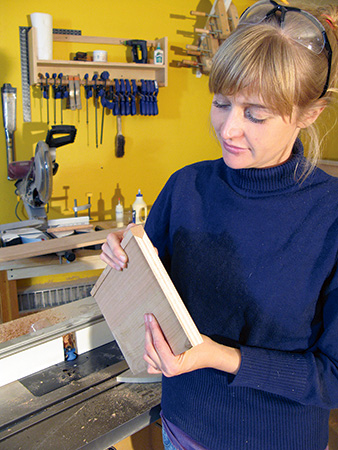 Test fitting hardwood edge banding on plywood panel