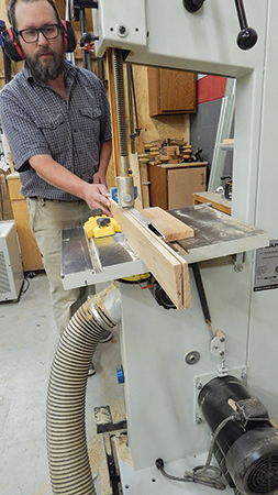 Start the roof lap-siding by making a tilted resaw cut at the band saw to form two siding pieces