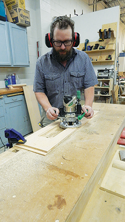 Rout a 1/8" x 3/8" rabbet around the inside edge of the window opening to serve as a recess for glass.