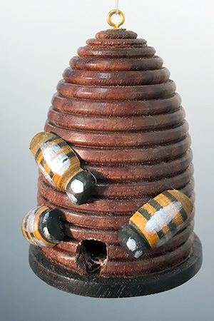 Bee pieces glued to the body of beehive ornament