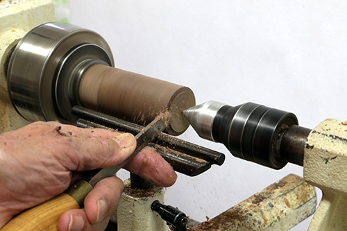 Finish rounding beehive ornament with parting tool