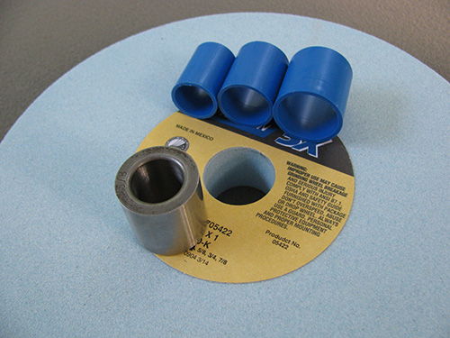 Steel and plastic bushings for bench grinder wheel