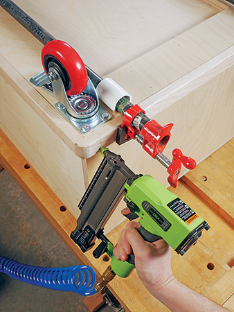 Attaching wood skirt to tool cart with a nail gun