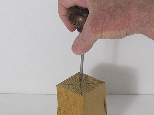 Marking center of awl handle blank