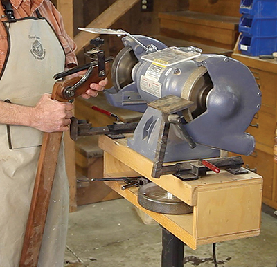 Jerry Glaser’s first sharpening jig for turners was built from wood and metal parts. It pivoted in a block taped to the floor in front of the grinder. If you moved the grinder, you had to move the block — which was also easy to trip on.