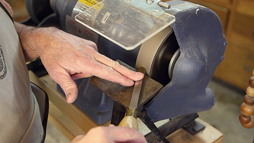 Grinding on a CBN wheel is very sedate. On scrapers, the burr is uniform. They grind at lower temperatures and don’t create a lot of sparks.