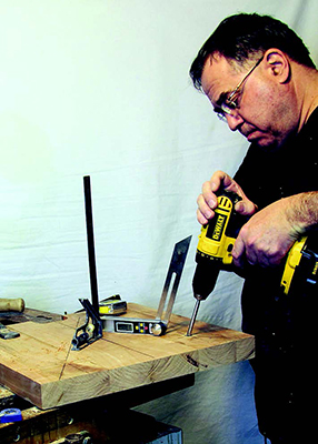 Drilling chair leg joinery on base