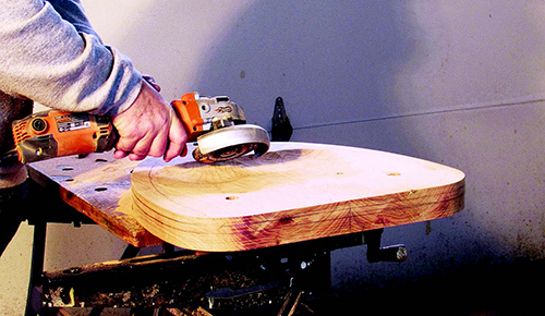 Cutting chair seat top with power carver