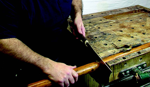 Cutting wooden oar in half